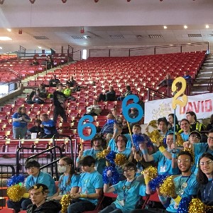 The Robotics Team in the bleachers during a competition.